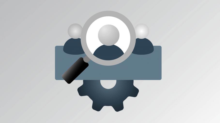 Magnifying glass aimed at a person with gears in the background