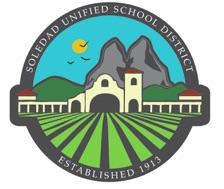 Mountains, farmland, and school building